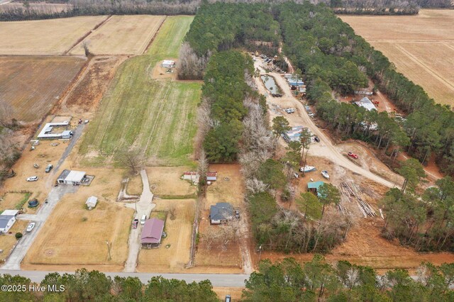 birds eye view of property with a rural view