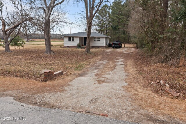 birds eye view of property with a rural view