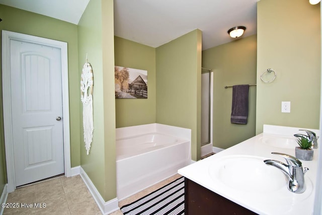 bathroom featuring tile patterned floors, vanity, and shower with separate bathtub