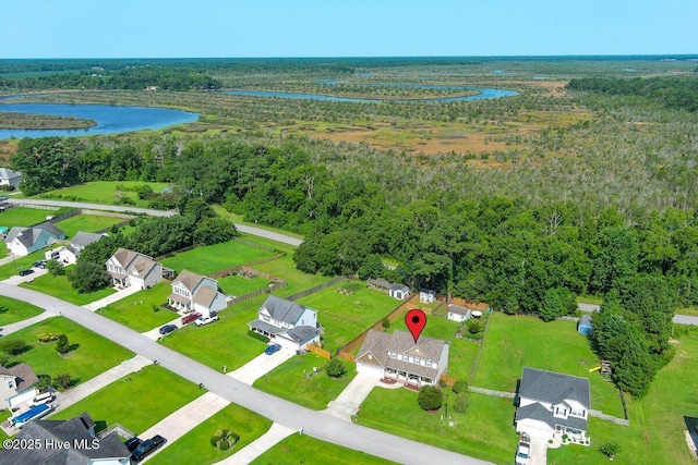 drone / aerial view with a water view