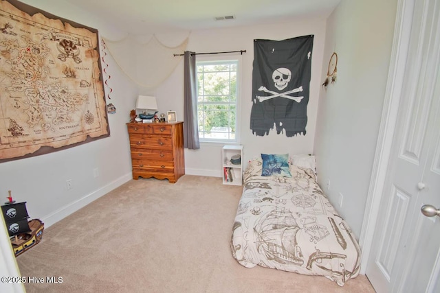 bedroom featuring light colored carpet