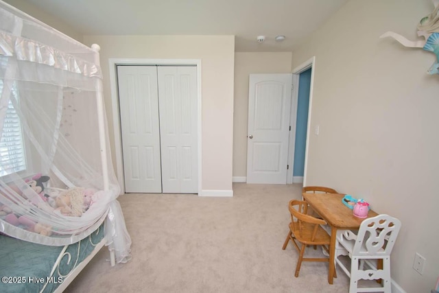 carpeted bedroom featuring a closet