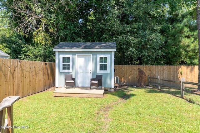 view of outbuilding with a yard