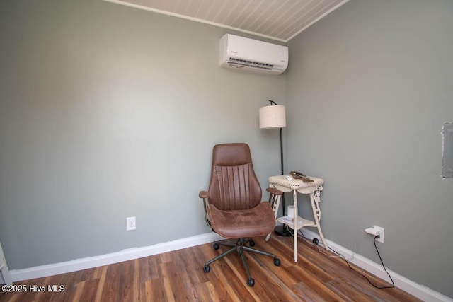 office space featuring dark hardwood / wood-style flooring and a wall unit AC