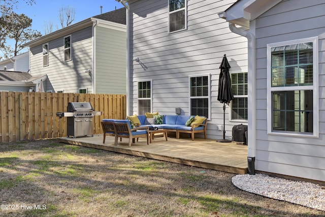 back of property featuring an outdoor living space, a lawn, and a wooden deck