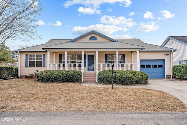 view of front of home with a porch and a garage