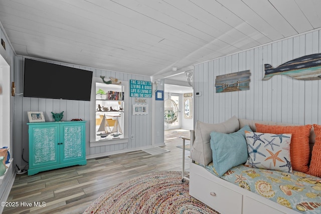 living room featuring wooden ceiling and hardwood / wood-style floors