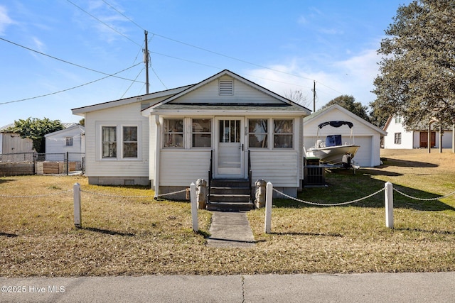 view of front of home with a garage and a front lawn