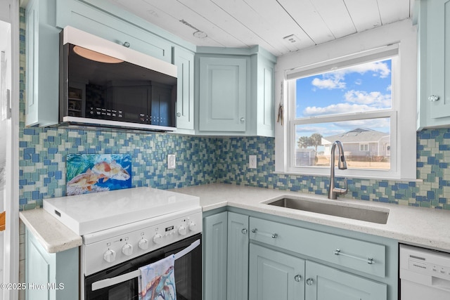 kitchen featuring wood ceiling, backsplash, stove, dishwasher, and sink