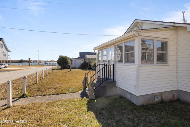 view of property exterior featuring a yard