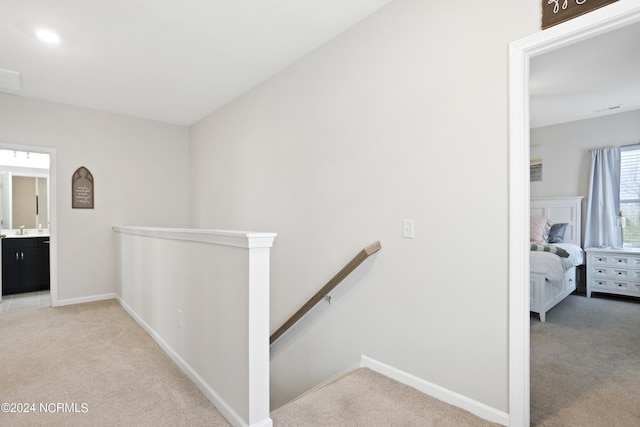 corridor with light carpet