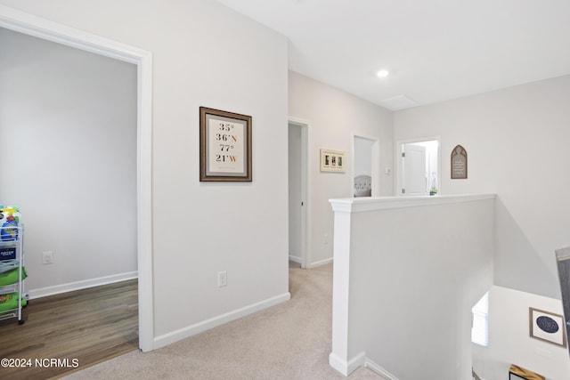 hallway featuring carpet flooring