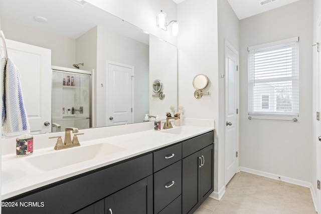 bathroom featuring vanity and an enclosed shower