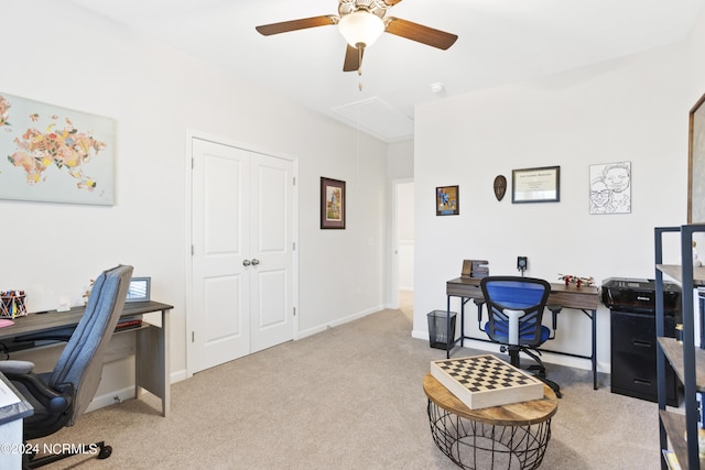 carpeted home office with ceiling fan