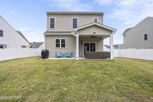 rear view of house featuring a lawn, ceiling fan, a patio, and an outdoor hangout area