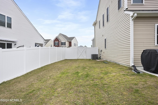 view of yard with central AC