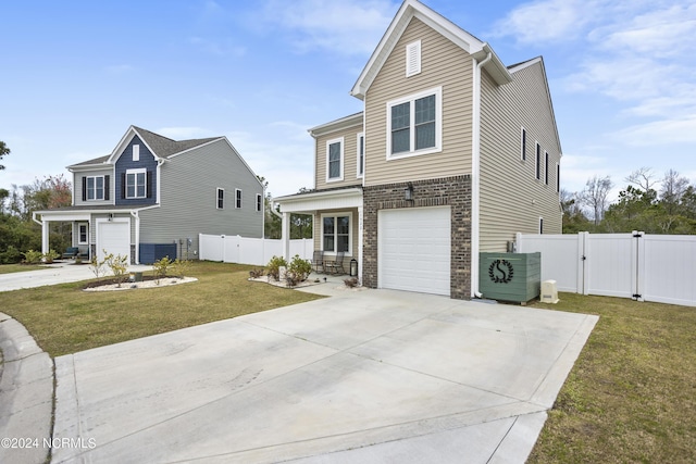 view of front property with a front yard and a garage