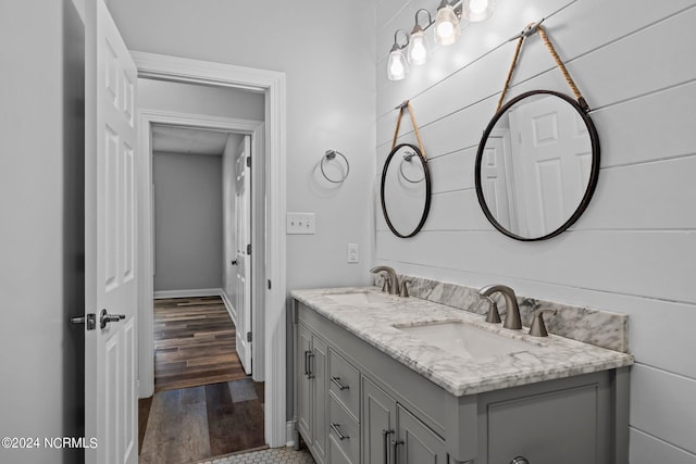 bathroom featuring vanity and wood-type flooring