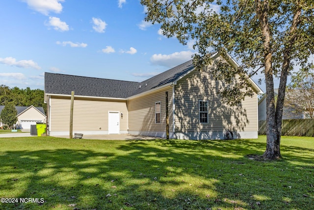 view of front of property with a patio area and a front lawn