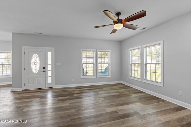 foyer with dark hardwood / wood-style flooring and ceiling fan