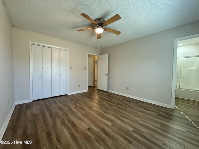 unfurnished bedroom featuring a textured ceiling, ceiling fan, a closet, and dark hardwood / wood-style floors