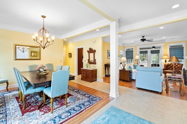 living room featuring ornamental molding, ceiling fan, and light wood-type flooring