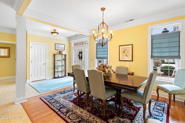 living room with crown molding, ceiling fan, and light wood-type flooring