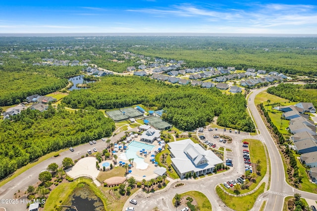 bird's eye view with a water view, a residential view, and a forest view