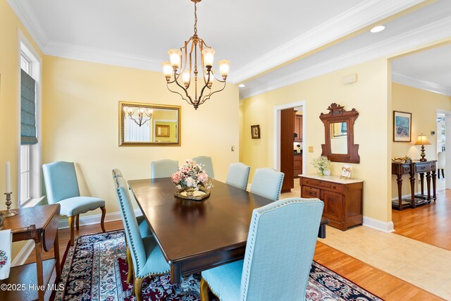 living room with crown molding and light hardwood / wood-style flooring