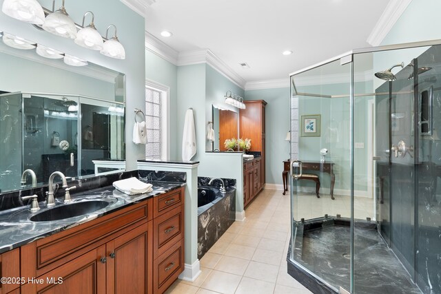 bathroom featuring a bath, tile patterned flooring, a shower stall, vanity, and ornamental molding