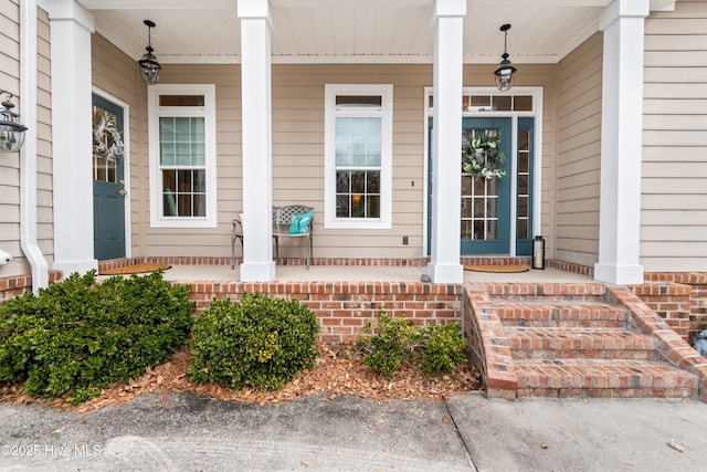 doorway to property featuring covered porch