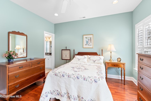 bedroom with visible vents, recessed lighting, and wood finished floors