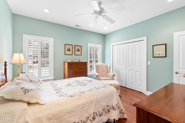 bedroom with ensuite bath, wood-type flooring, and ceiling fan