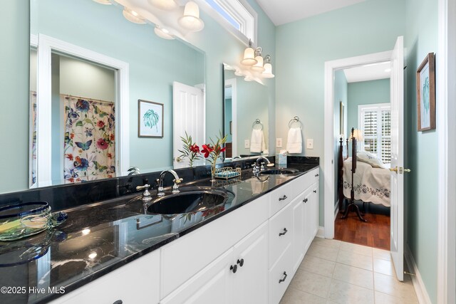 bathroom featuring tile patterned floors and vanity