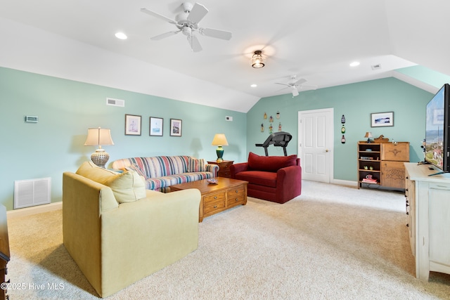 living area featuring visible vents, ceiling fan, vaulted ceiling, and carpet floors