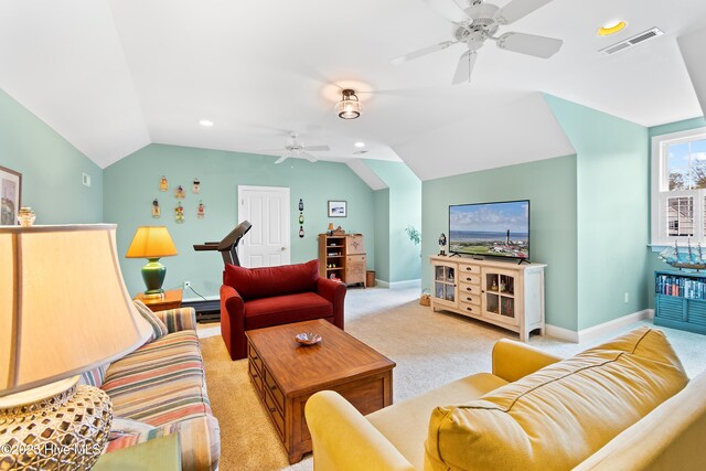 living room with lofted ceiling, light colored carpet, and ceiling fan