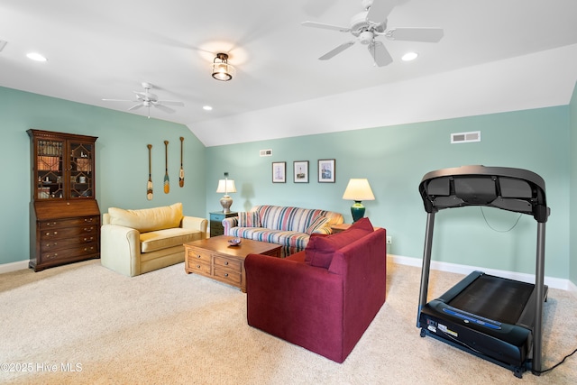 living room featuring ceiling fan, carpet, vaulted ceiling, and visible vents