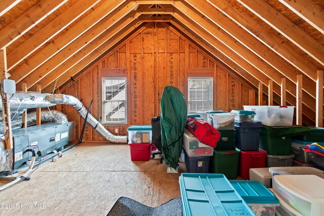 carpeted living room featuring vaulted ceiling and ceiling fan