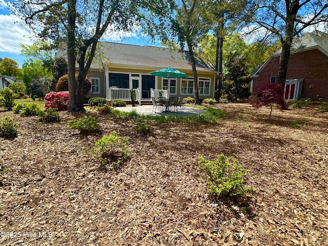 rear view of house featuring a patio