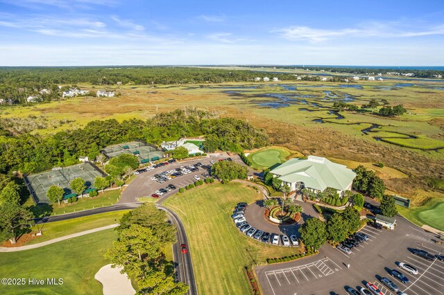 aerial view with view of golf course and a water view