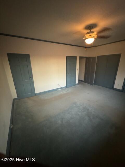 unfurnished room with ceiling fan