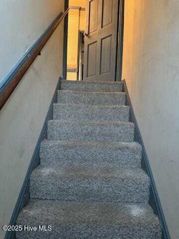 stairs featuring a barn door