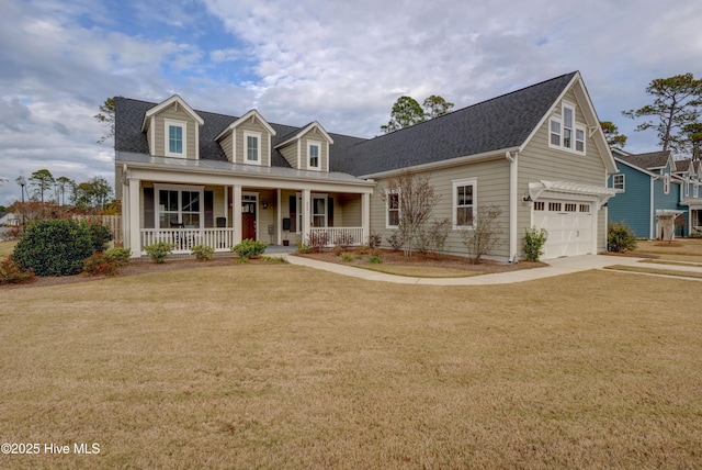 cape cod-style house featuring covered porch and a front yard