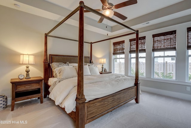 bedroom featuring light carpet and ceiling fan