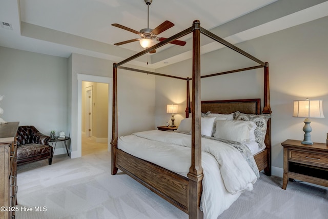 bedroom with ceiling fan and light carpet