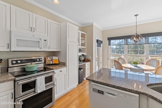 kitchen featuring an inviting chandelier, white cabinetry, and white appliances