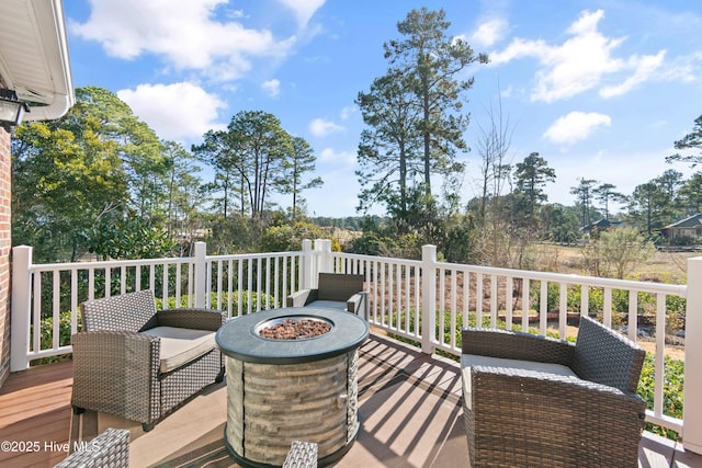 deck featuring an outdoor fire pit