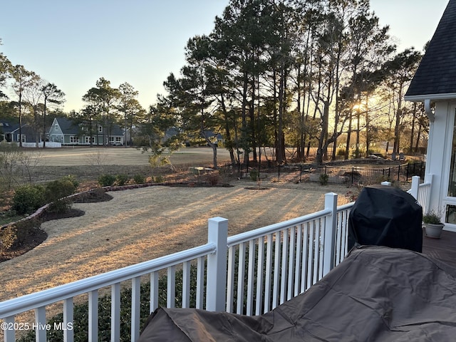 deck at dusk with a grill