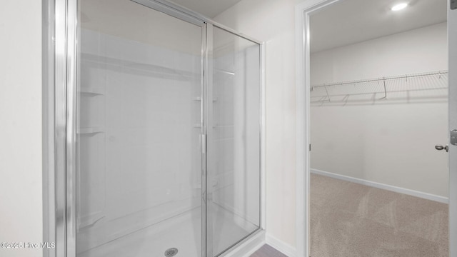 bathroom featuring an enclosed shower