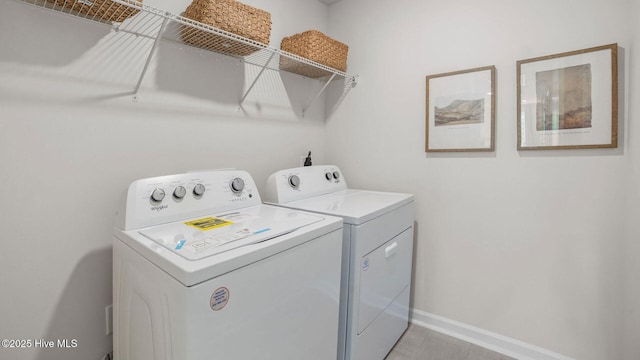 laundry room with independent washer and dryer